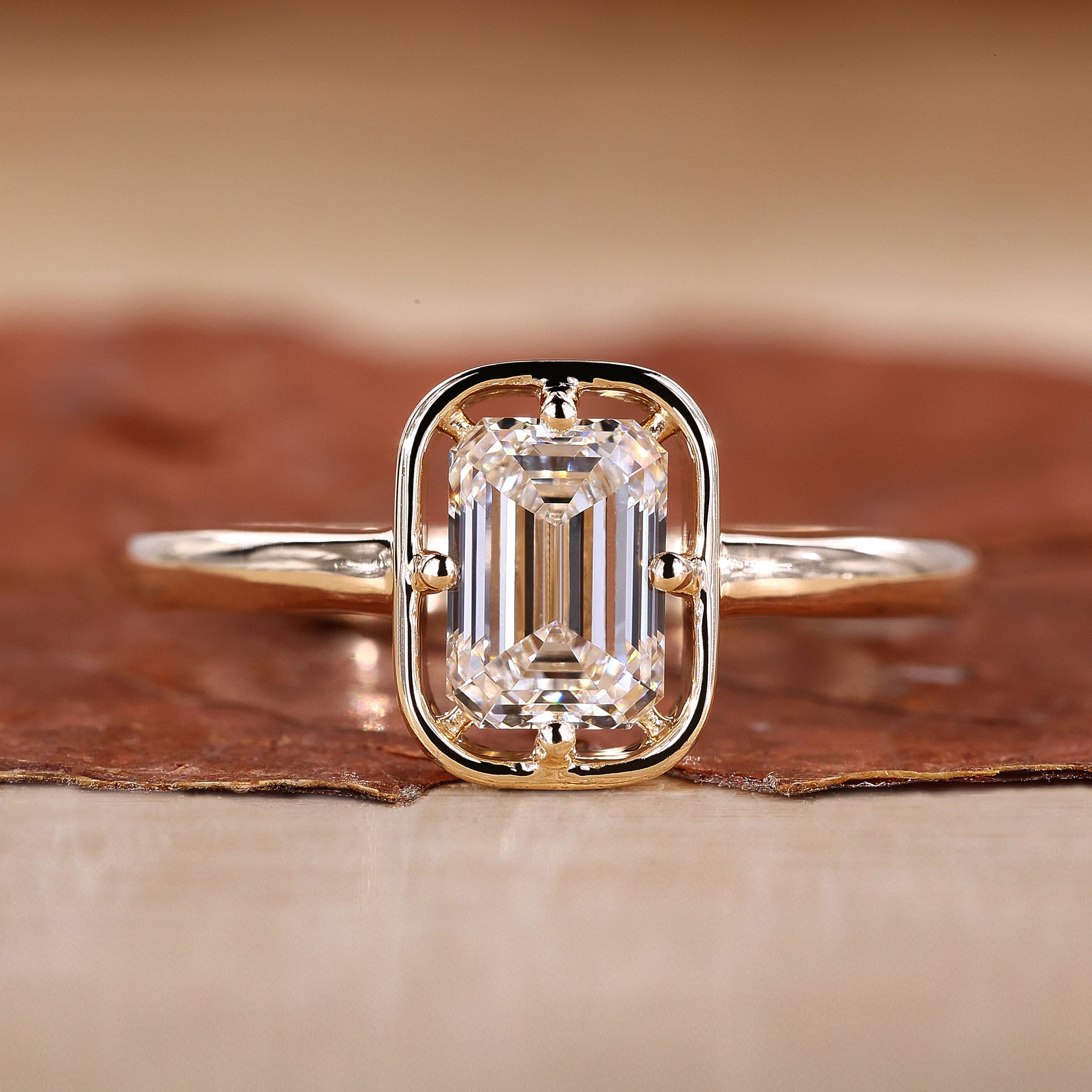 Emerald Cut Engagement Ring is designed with yellow gold ring.
