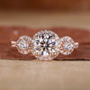 Three stone engagement ring in rose gold.
