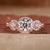 Three stone engagement ring in rose gold.
