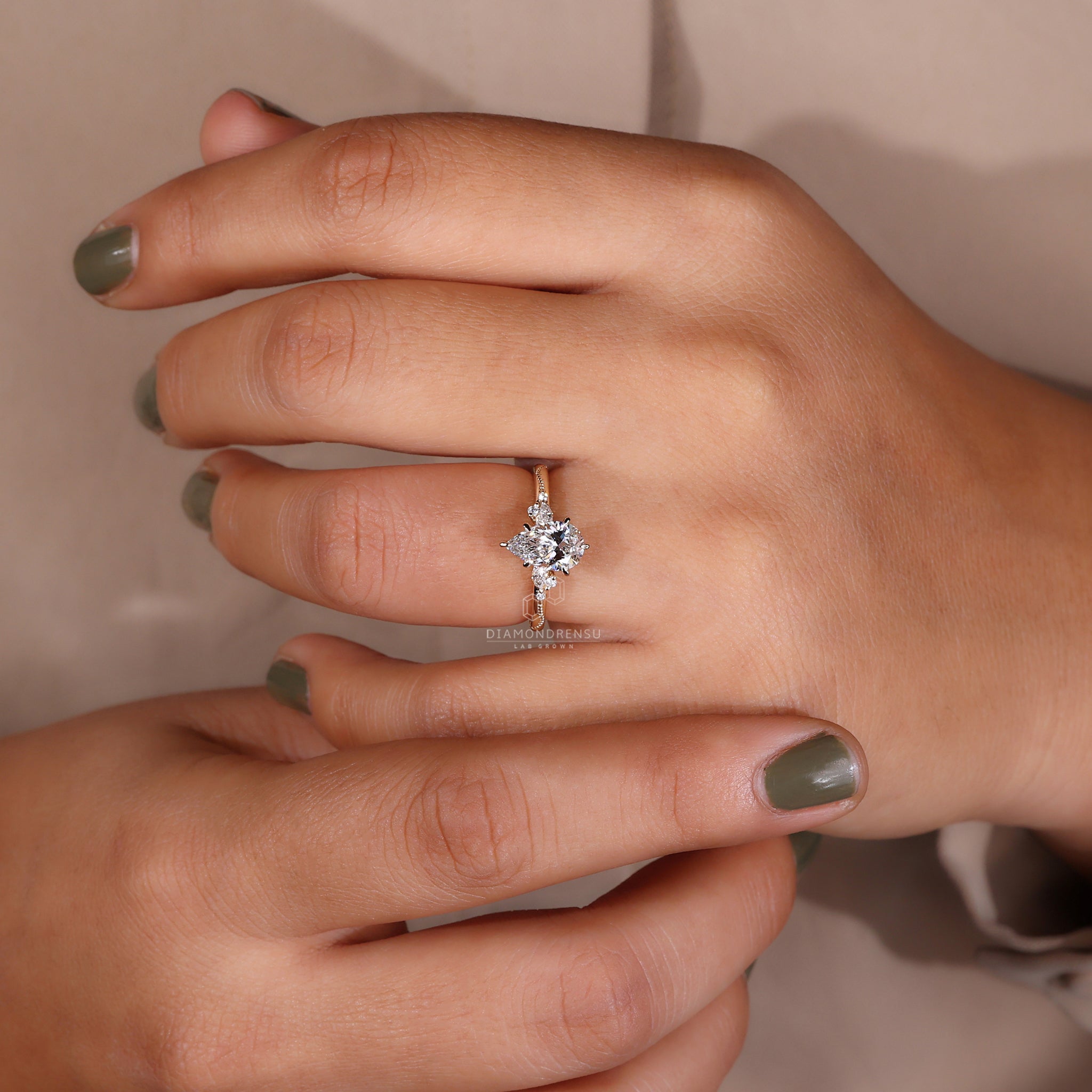 Unique engagement ring UK with a lab grown pear diamond.