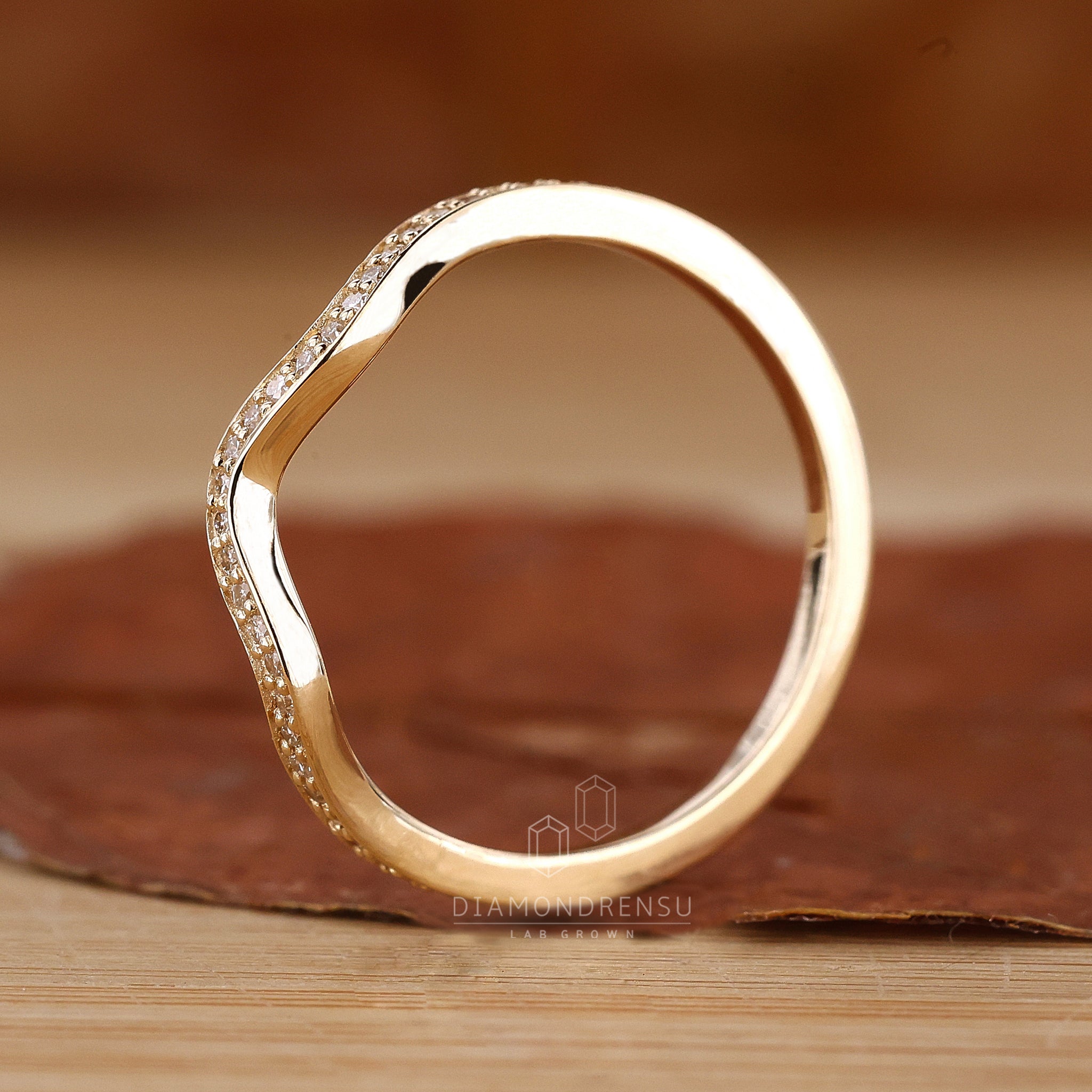 Elegant curved diamond wedding band UK
