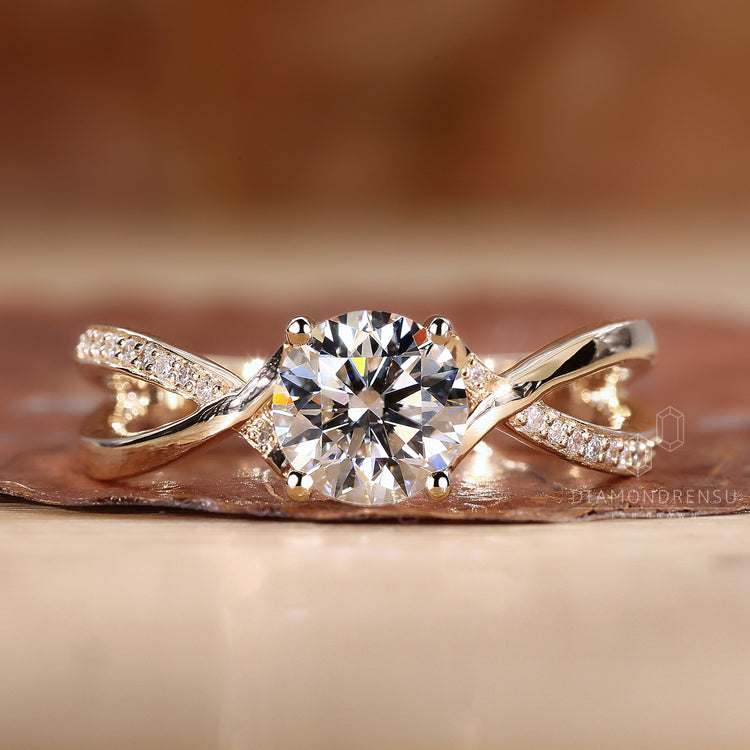 Yellow gold engagement ring with twist.
