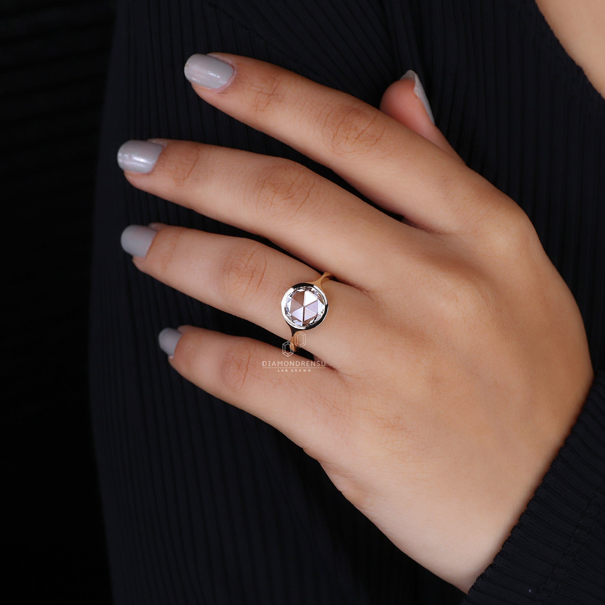 Round rose cut diamond with bezel setting.
