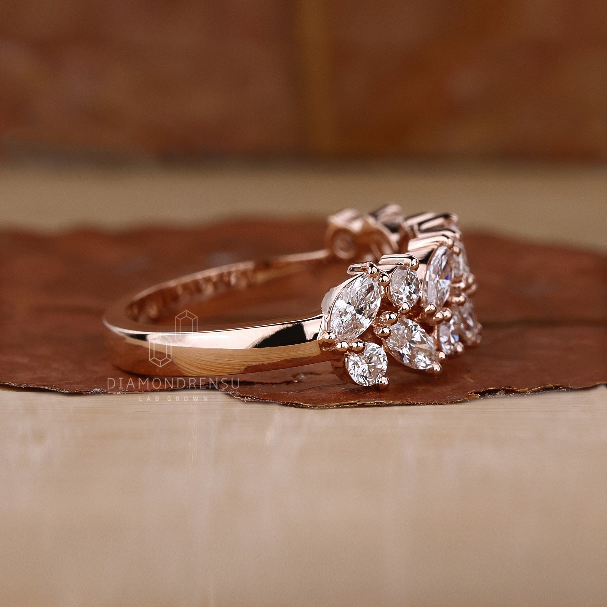 Elegant rose gold wedding band with marquise diamonds.
