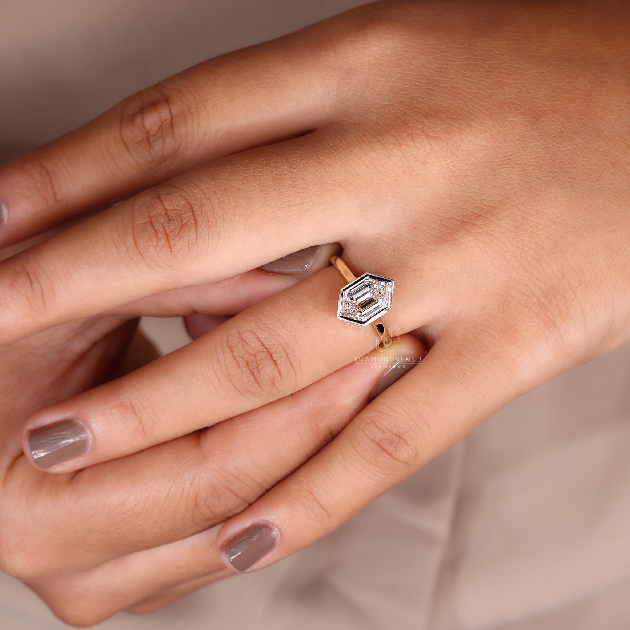 Lab grown diamond set in simple engagement ring design.
