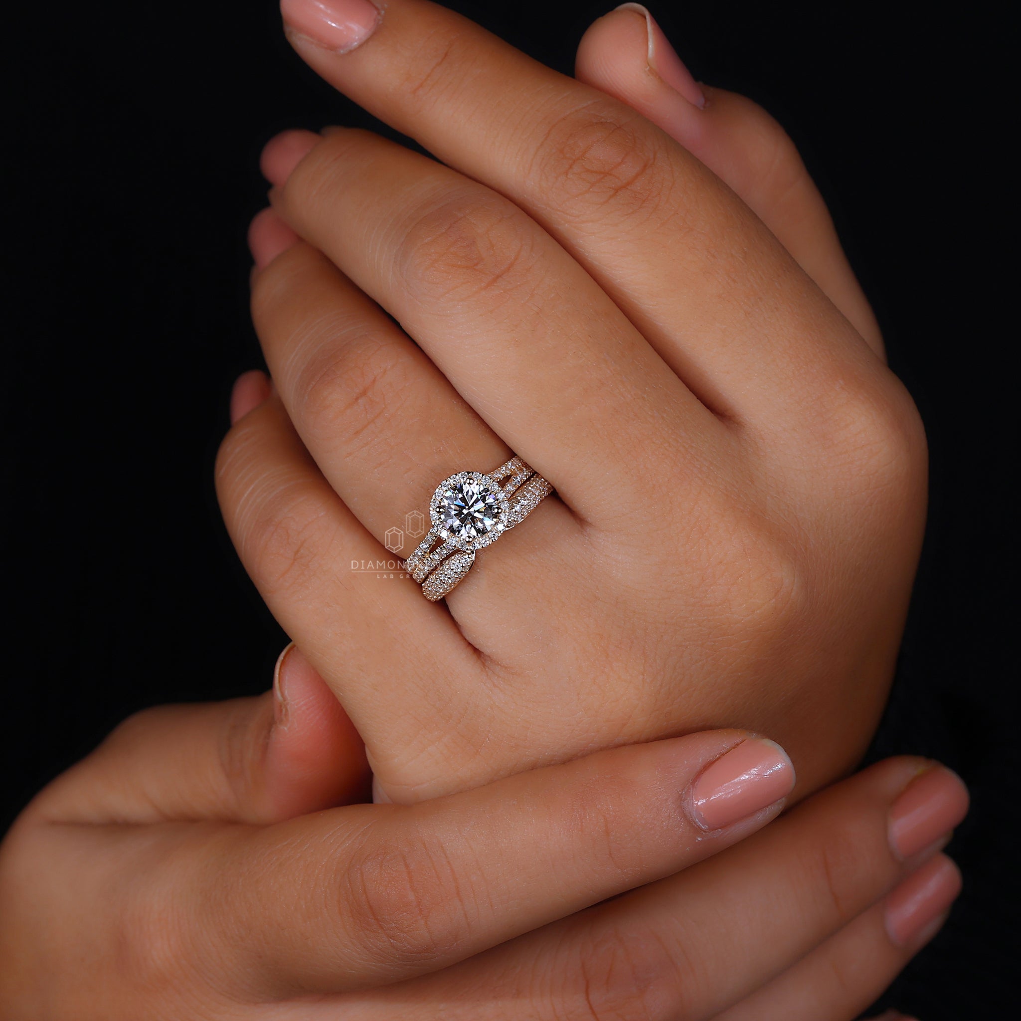 Split pave band with round halo setting.
