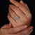 Split pave band with round halo setting.
