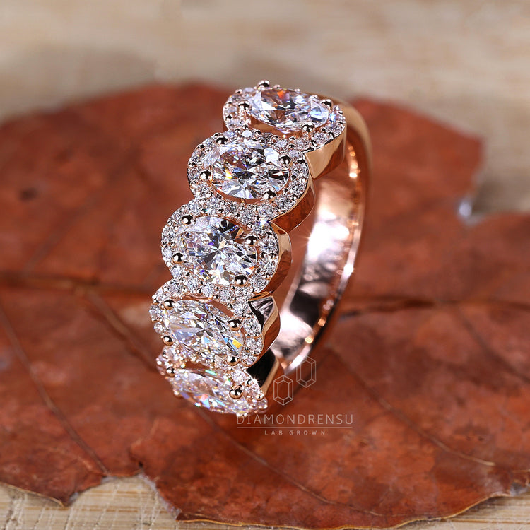 Rose gold ring with a soft tone and a contemporary diamond arrangement.
