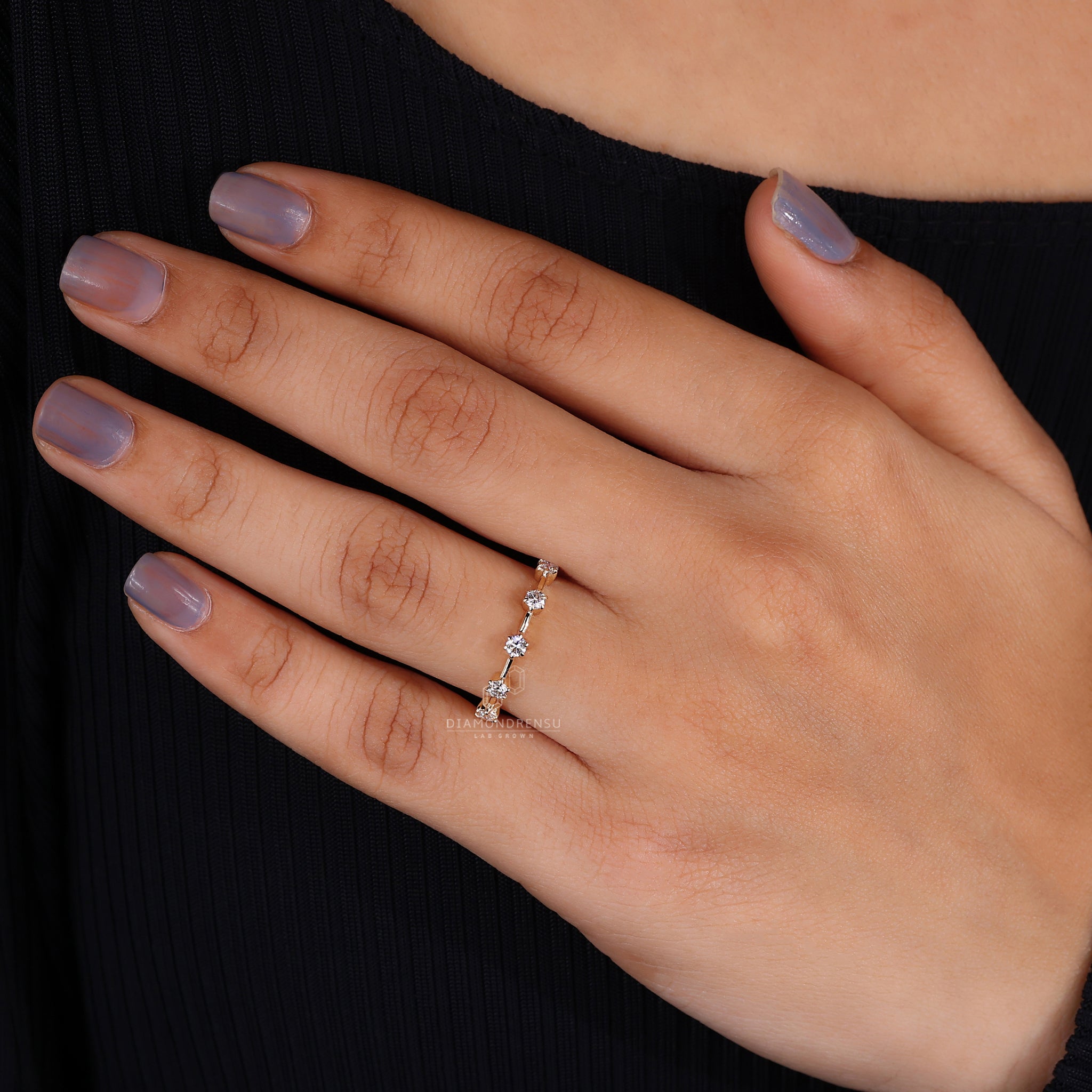 Yellow gold minimalist wedding band with diamonds
