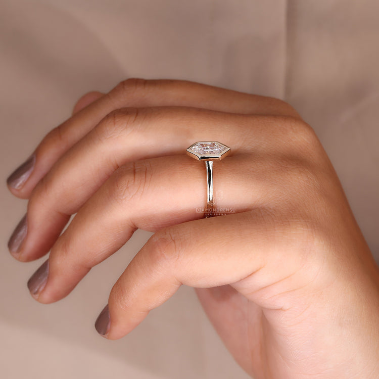 UK engagement ring featuring hexagon engagement ring shape.
