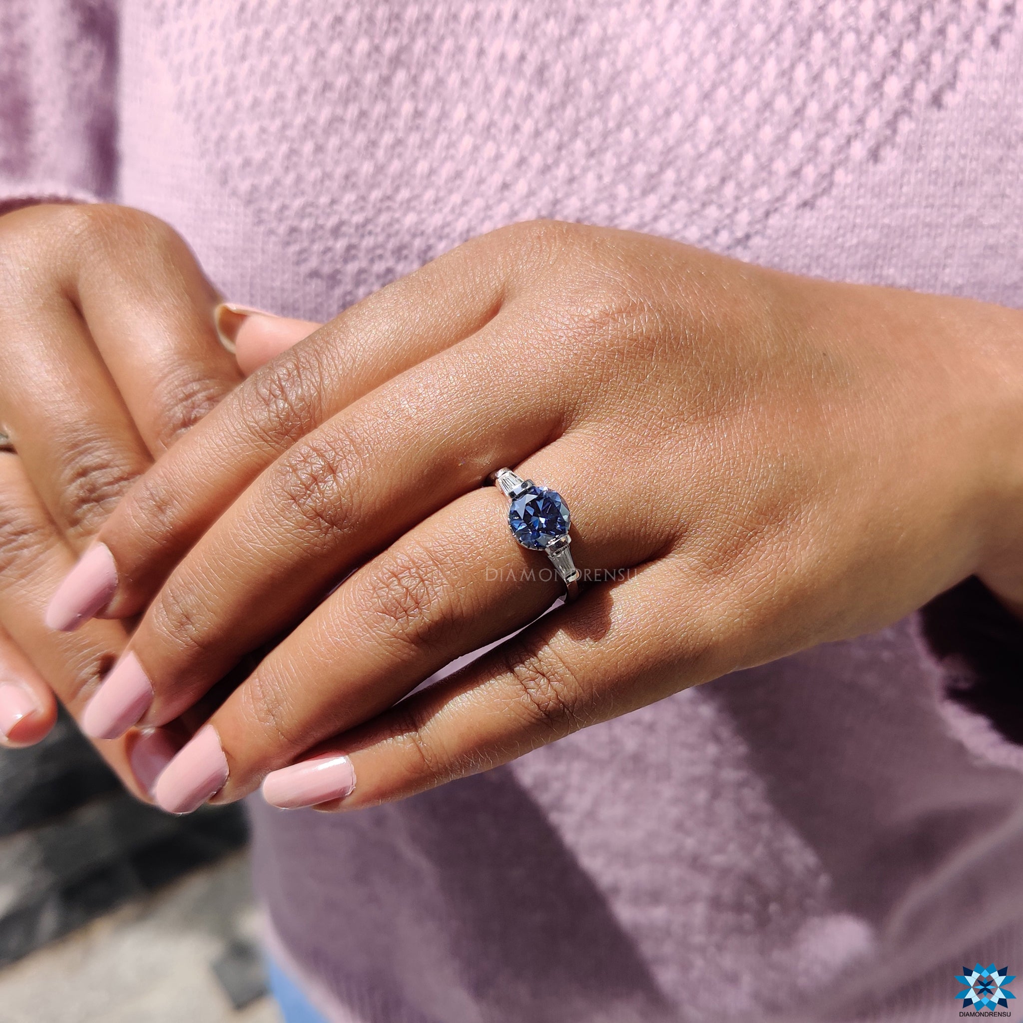 Buy engagement ring with three stone dark blue moissanite design.
