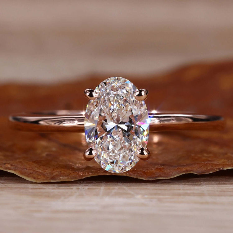 Gold Oval Diamond Engagement Ring with a timeless solitaire setting for elegance.