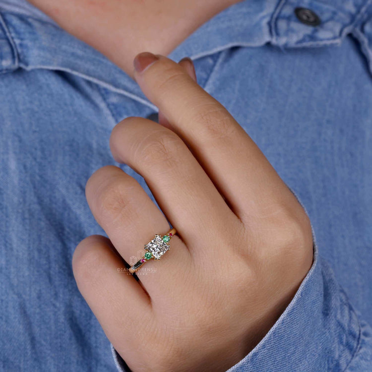 Green sapphire engagement ring in gold, featuring princess cut diamonds for an elegant and unique engagement ring design.
