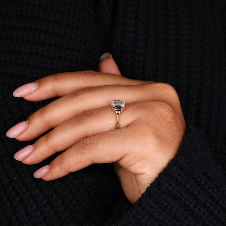 Yellow gold ring in emerald cut ring design
