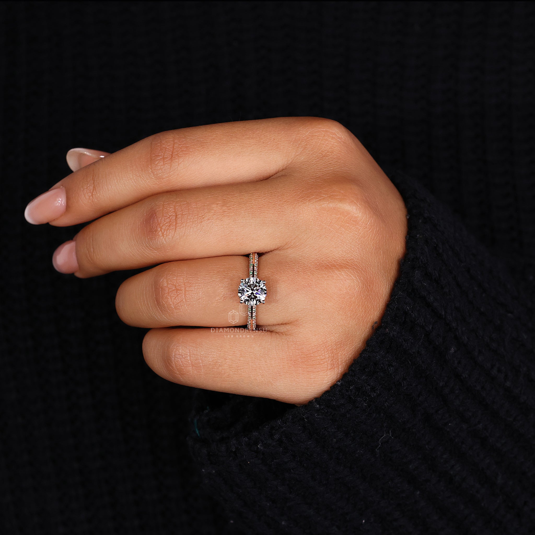 Round diamond engagement ring in knife edge pave setting ring
