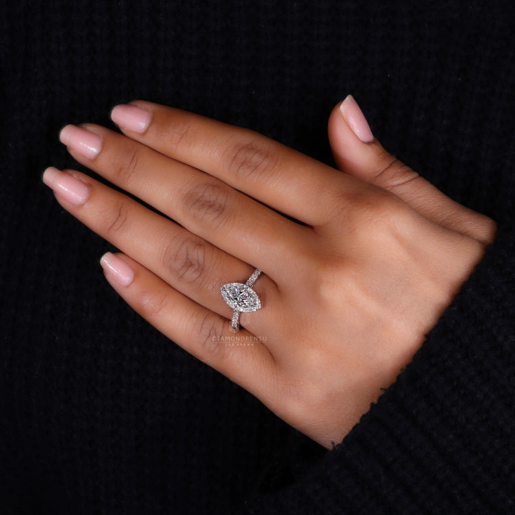 Pave setting ring featuring round and marquise diamonds.
