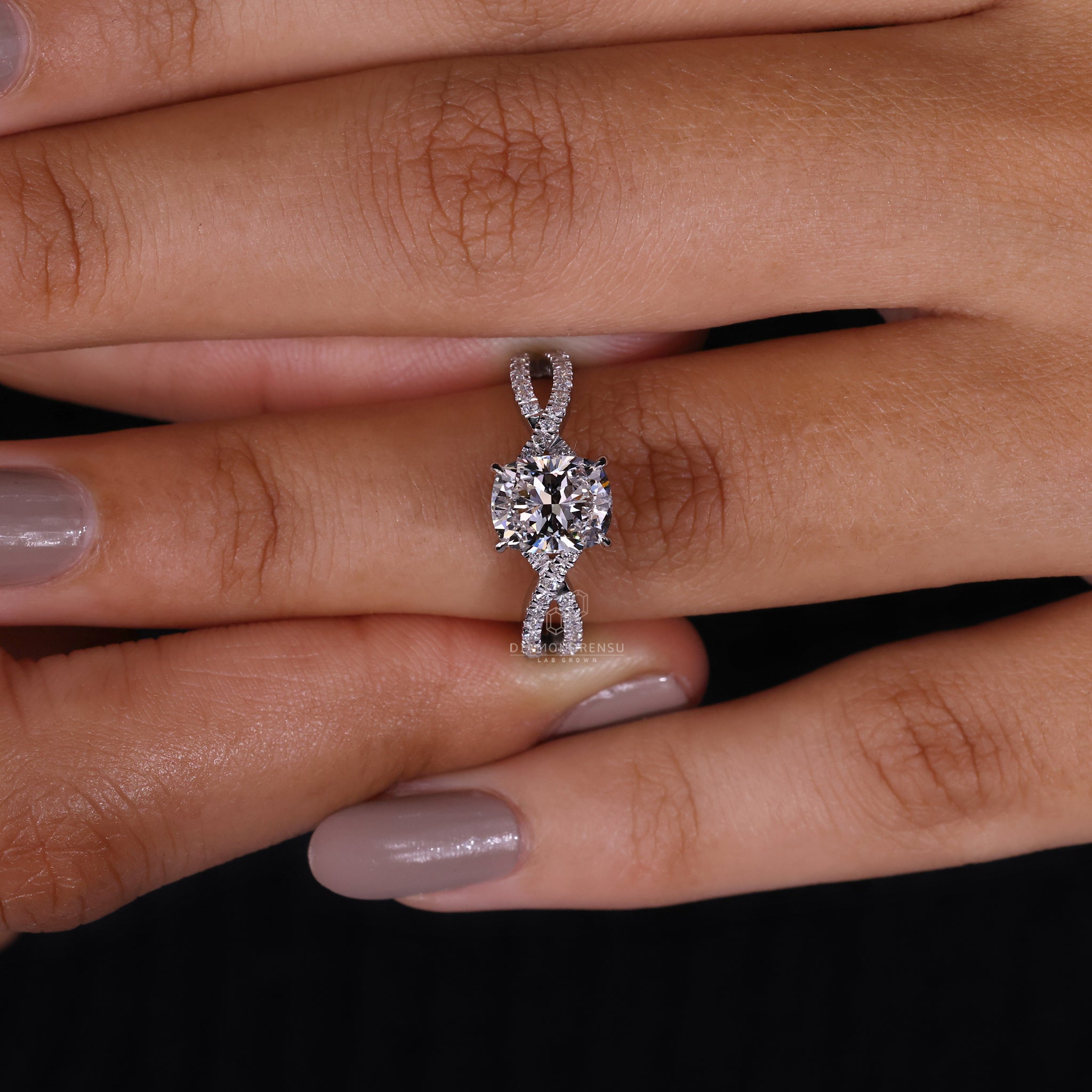 Round cut pavé setting on a classic white gold engagement ring.
