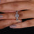 Round cut pavé setting on a classic white gold engagement ring.
