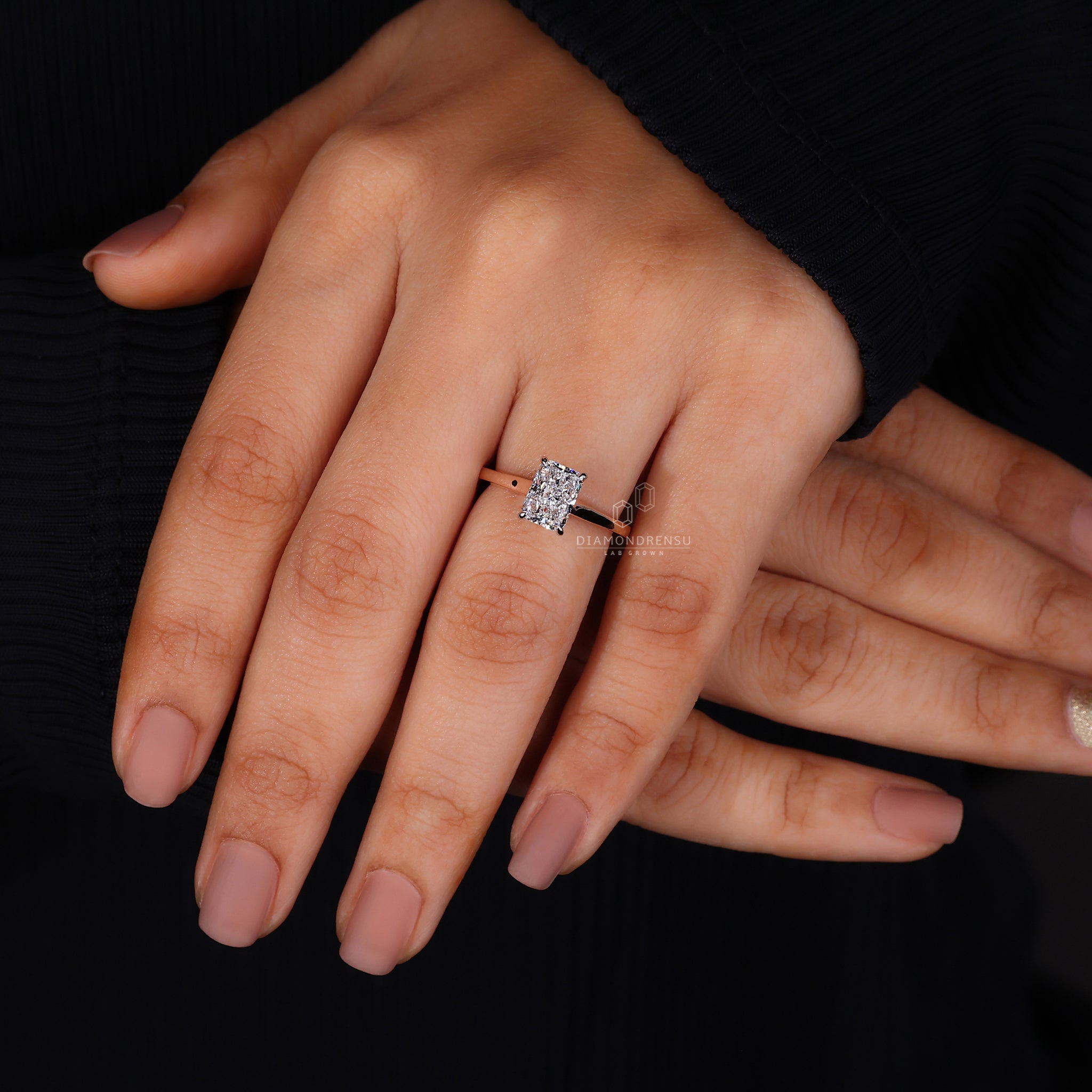 Rose gold ring in radiant cut cathedral setting.
