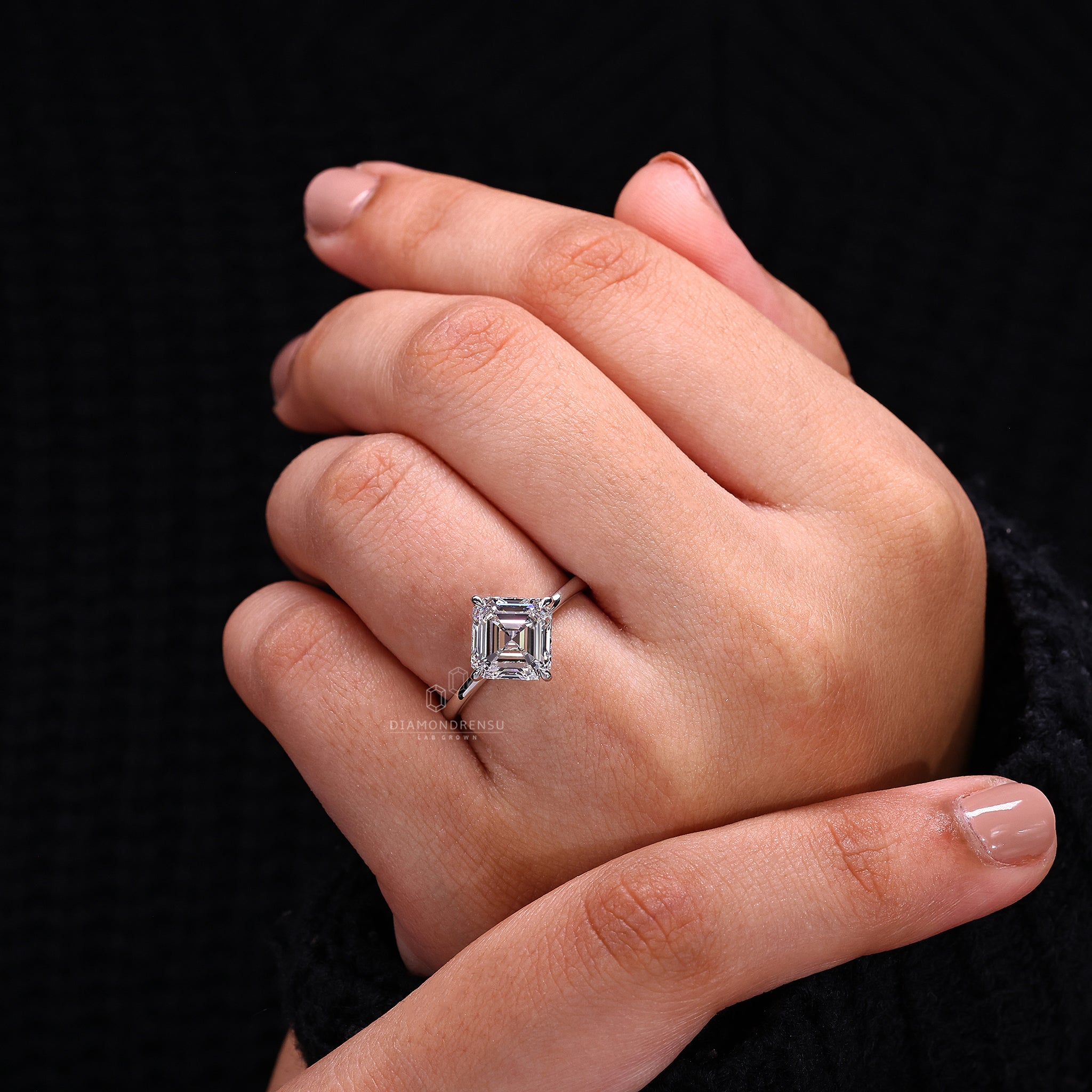 IGI certified asscher cut diamond is set in compass prong for durability.
