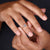 Yellow gold ring with a sleek tapered ring shank design.
