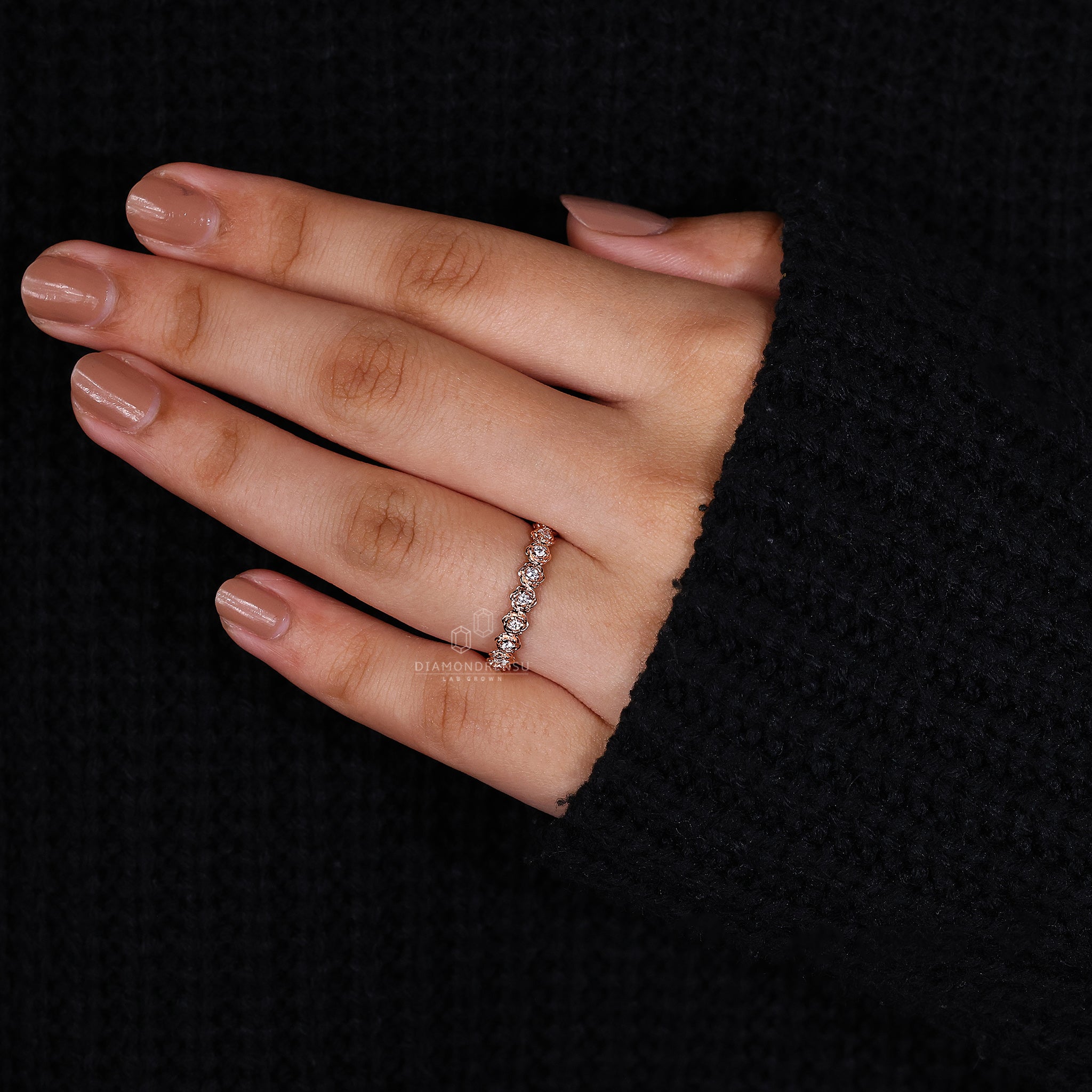 Rose gold wedding band in prong setting
