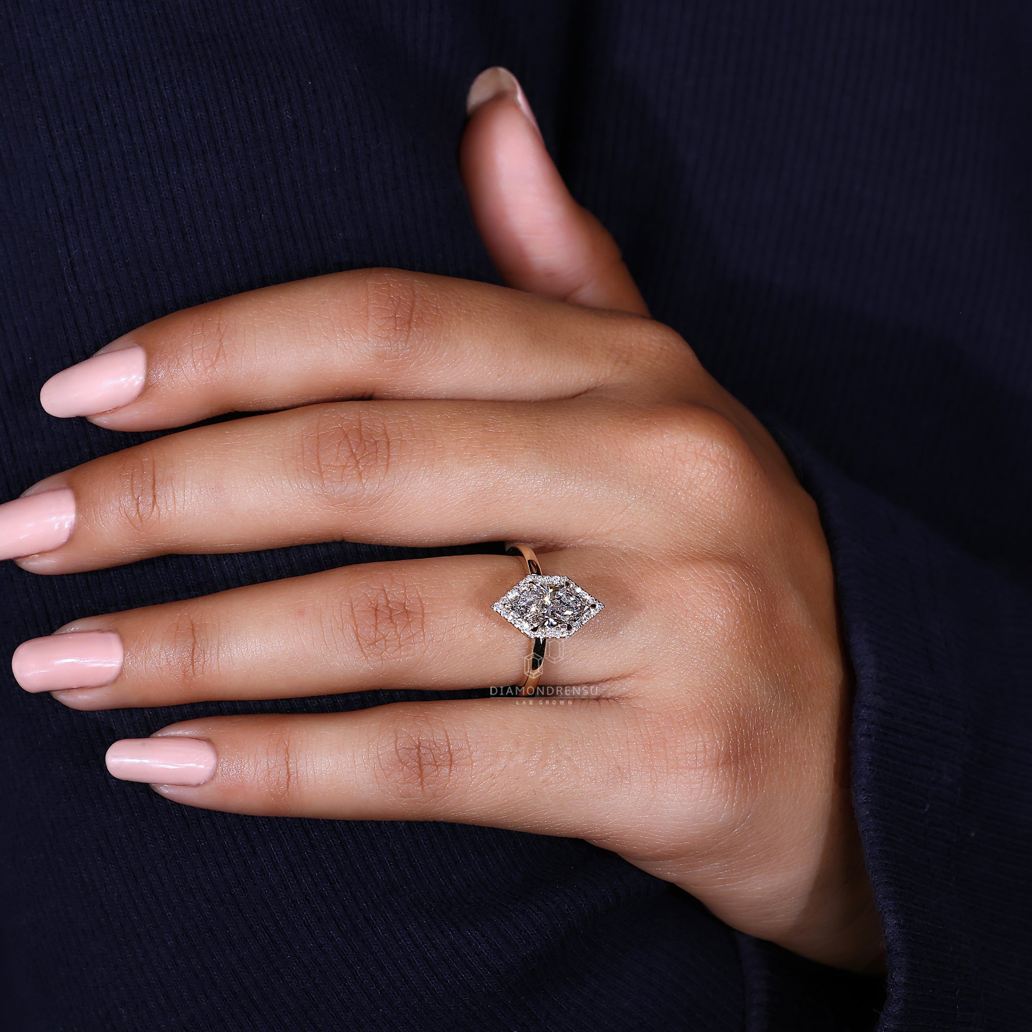 Handmade ring with halo diamond and claw prong setting.
