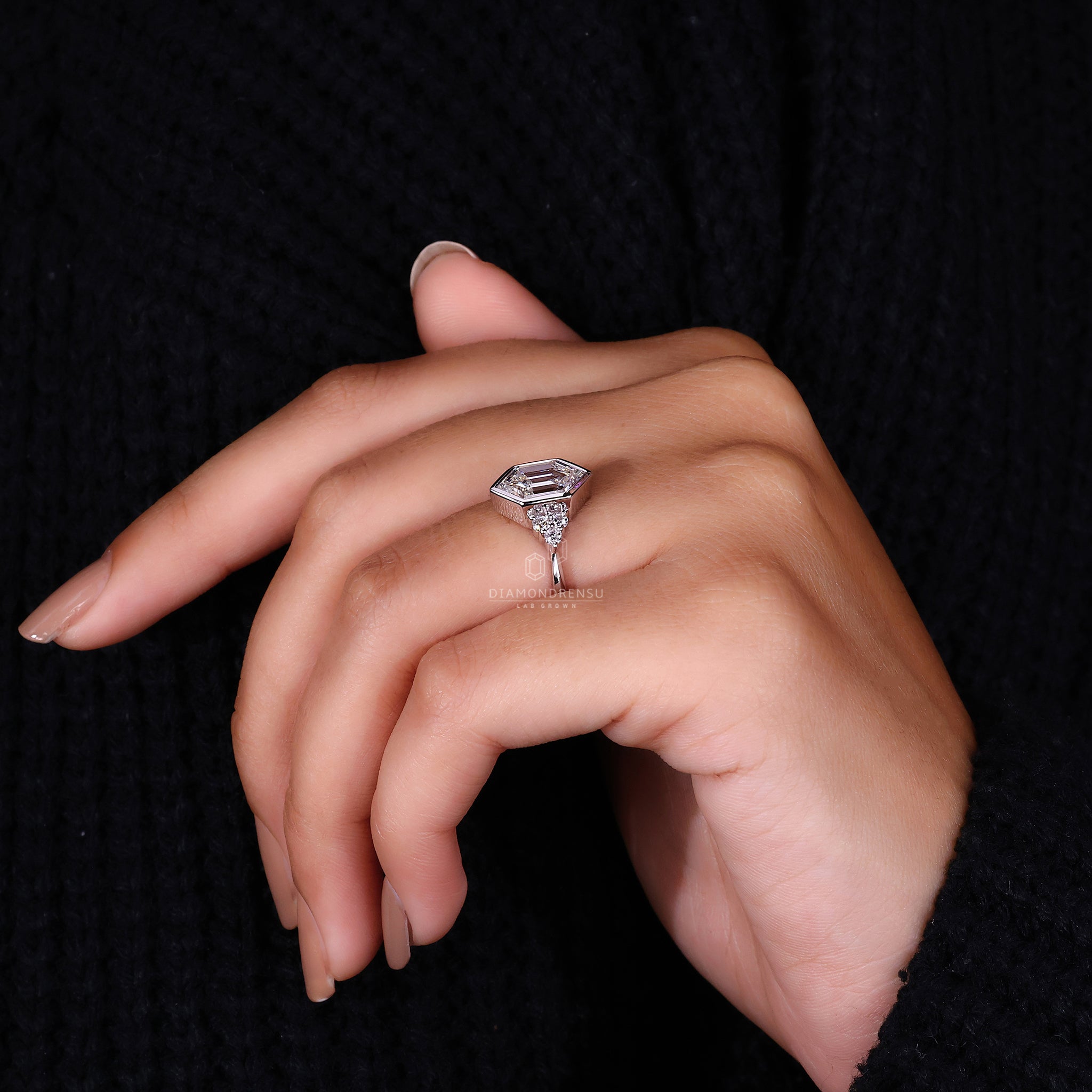 Diamondrensu UK ring with hexagon step cut diamond.
