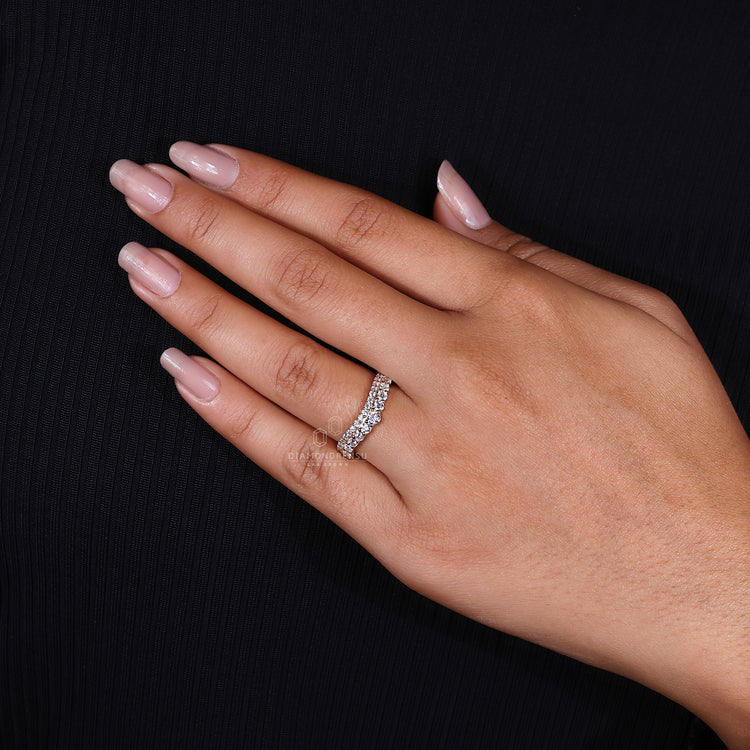 Elegant curved diamond band with round cut diamonds.
