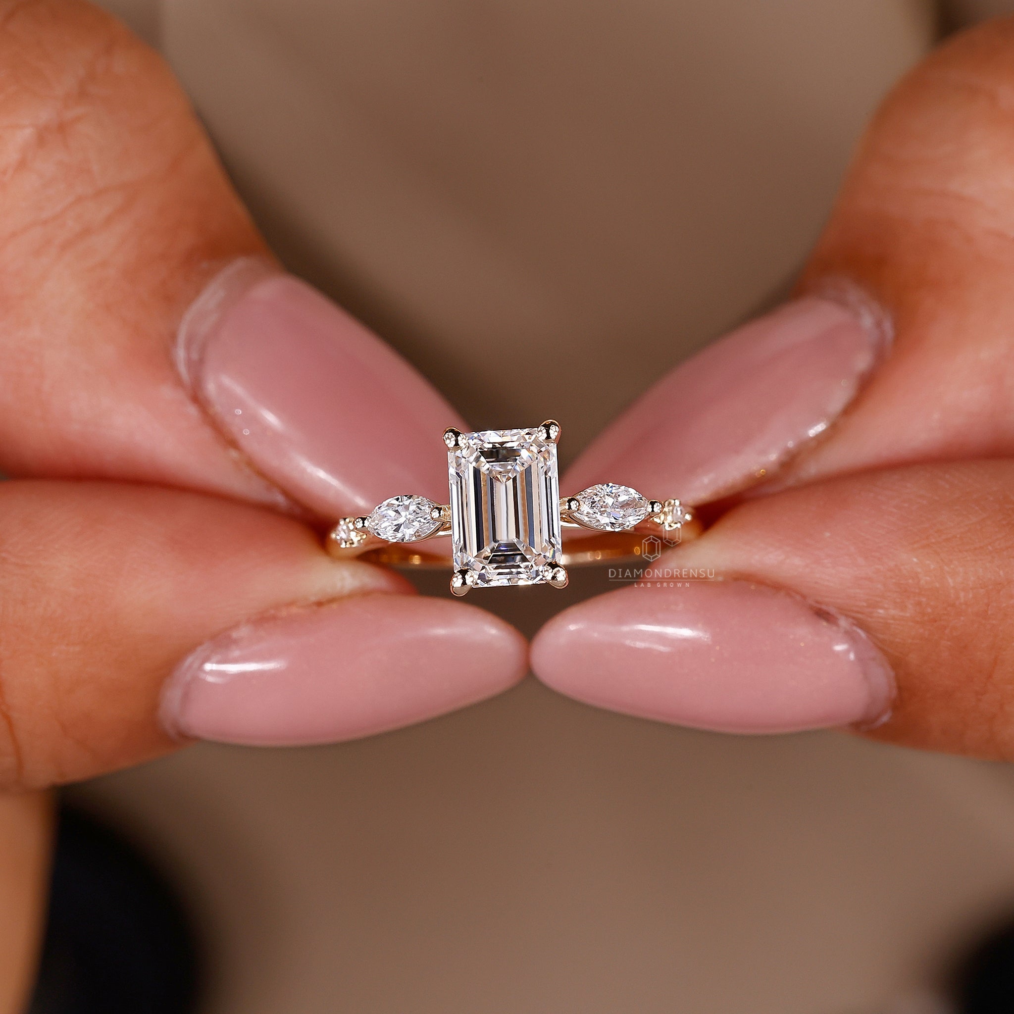 Custom engagement ring with 5 stone design and yellow gold finish.
