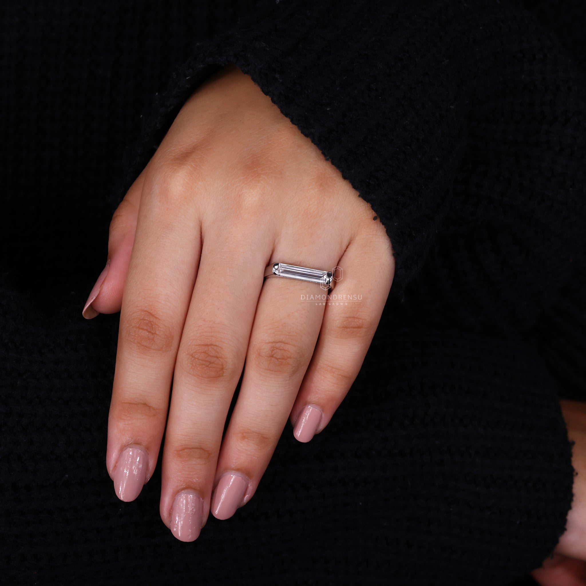 Diamondrensu UK engagement ring with a bezel setting.