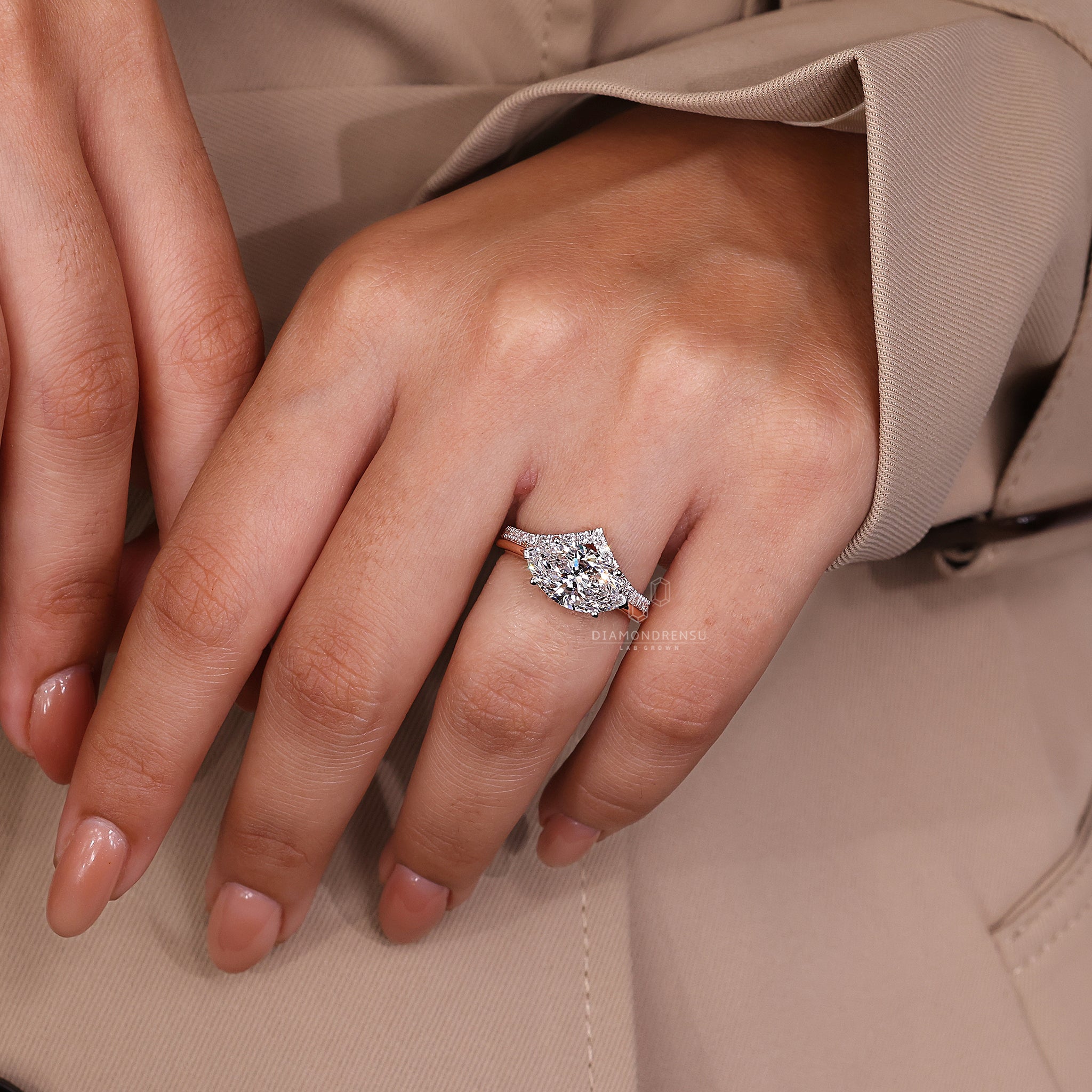 Diamondrensu UK engagement ring with hidden halo and two tone band.
