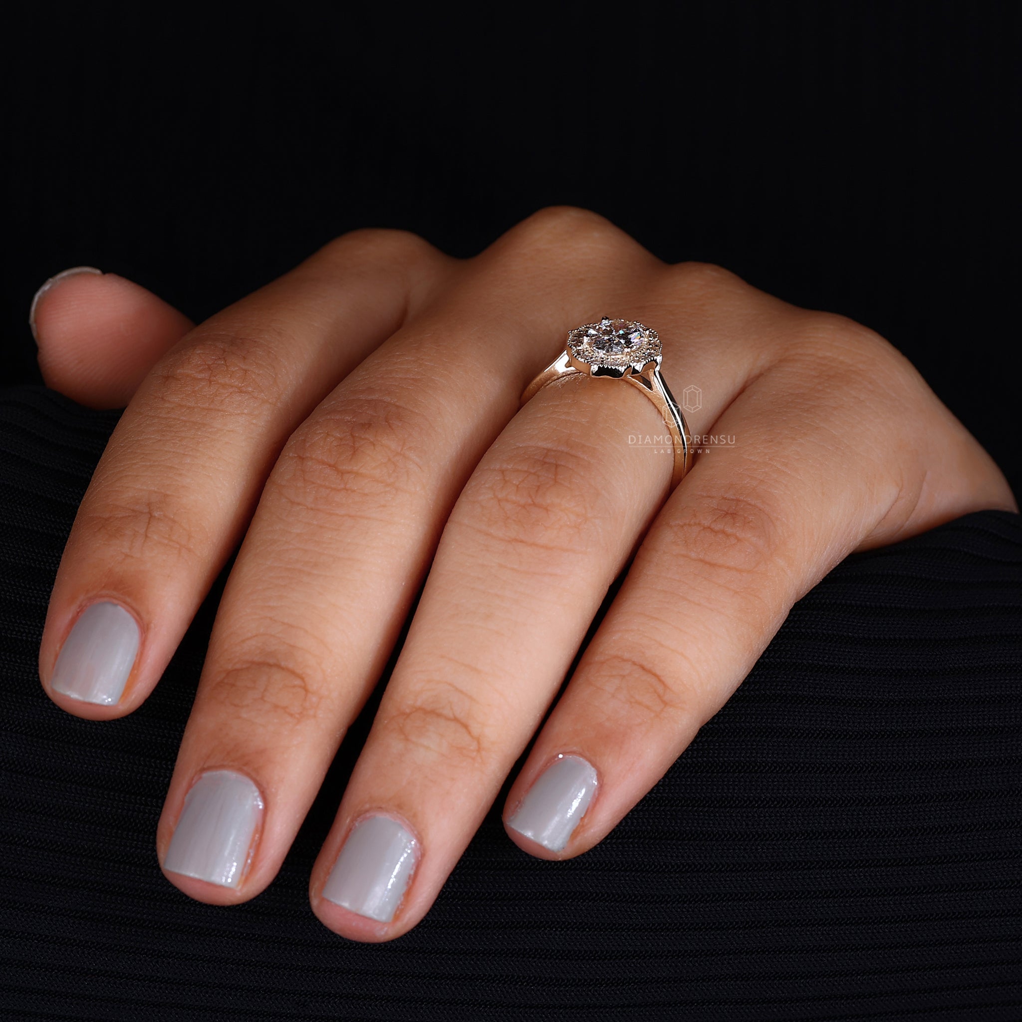 Classic halo diamond ring with intricate detailing for a sophisticated look.