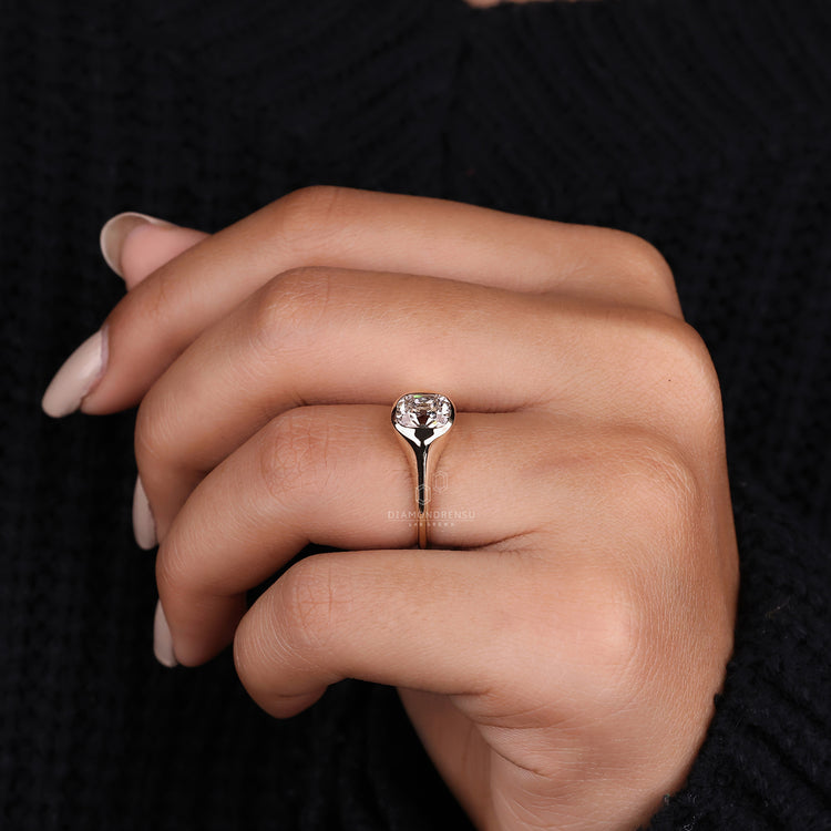 Tapered shank ring set in yellow gold engagement ring.
