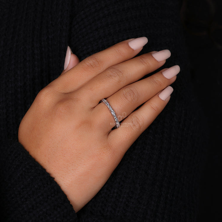Emerald and round cut diamond half eternity band.
