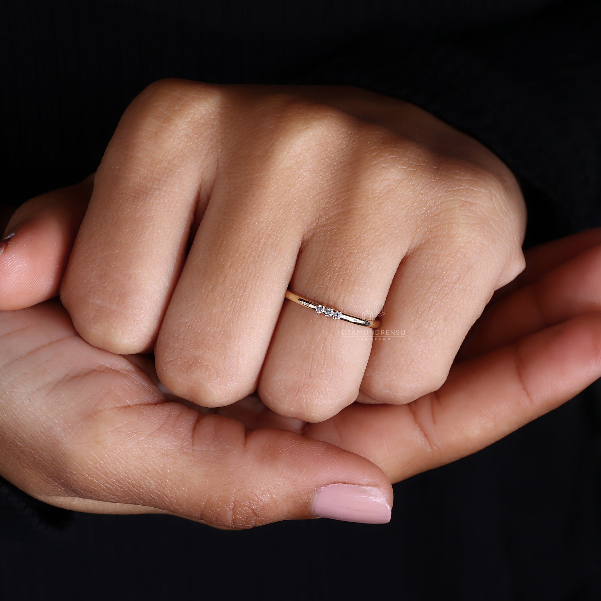 Yellow gold wedding band with round diamonds.
