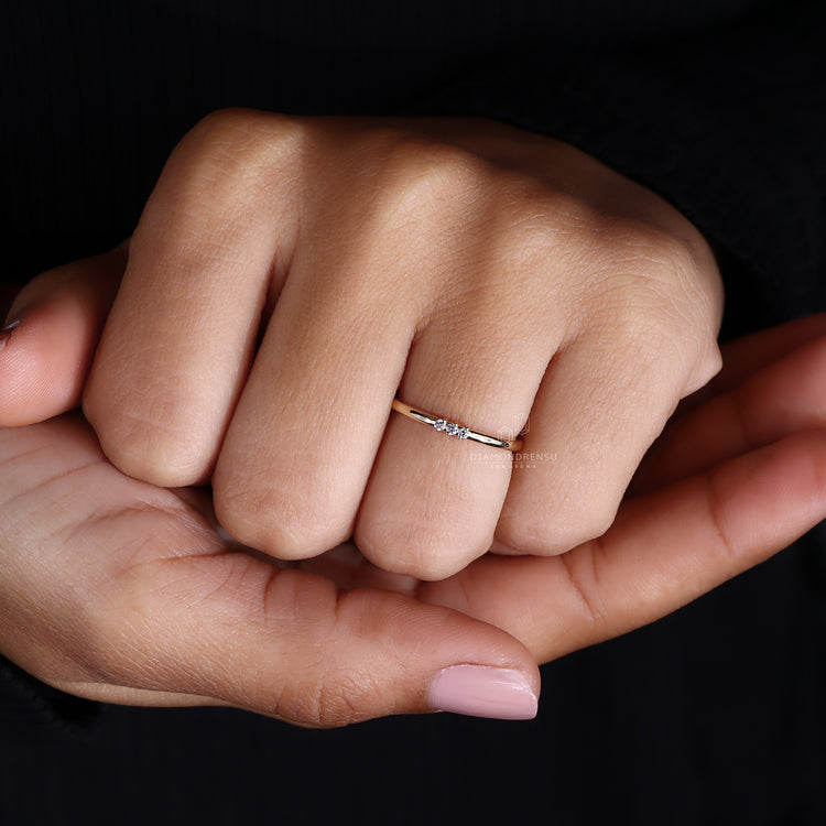 Yellow gold wedding band with round diamonds.
