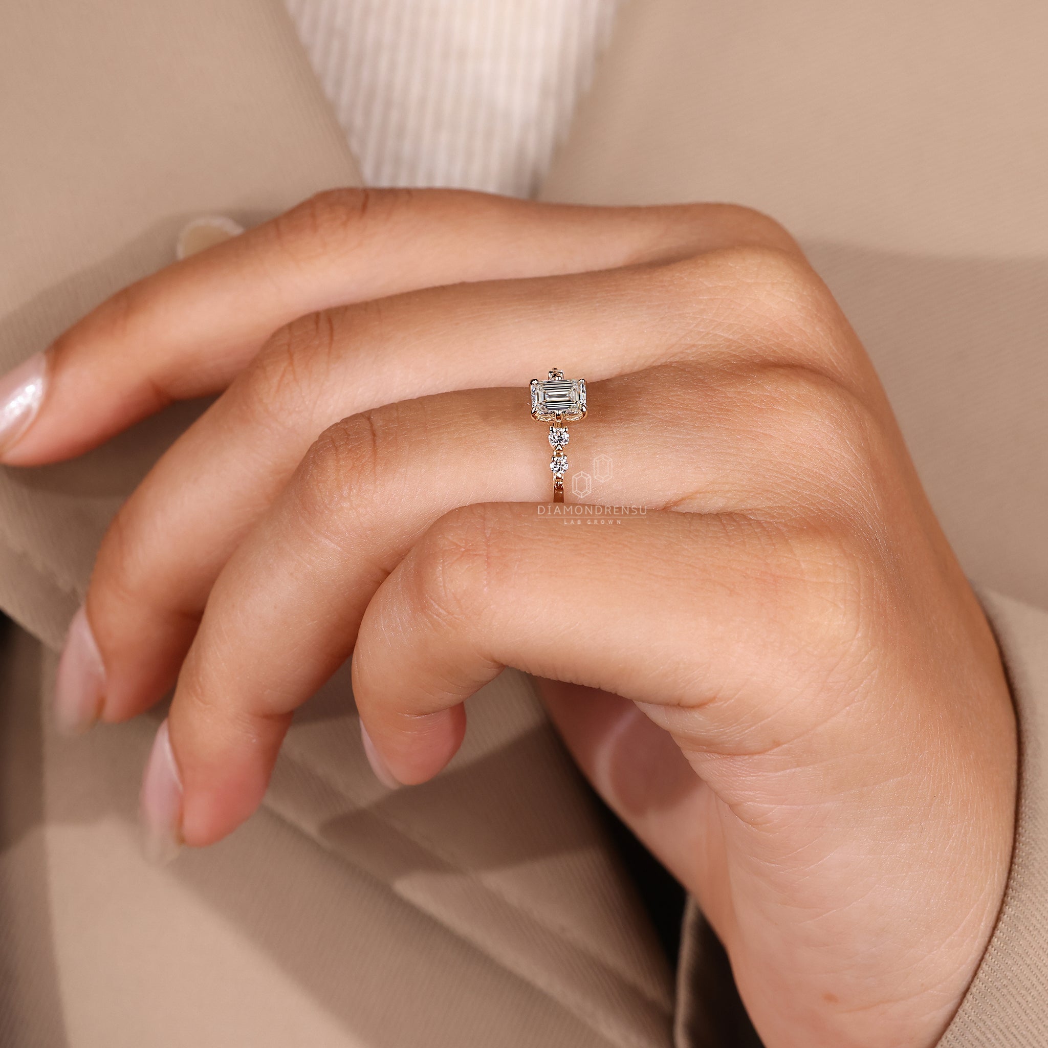 Lab grown diamond engagement ring with five stones.
