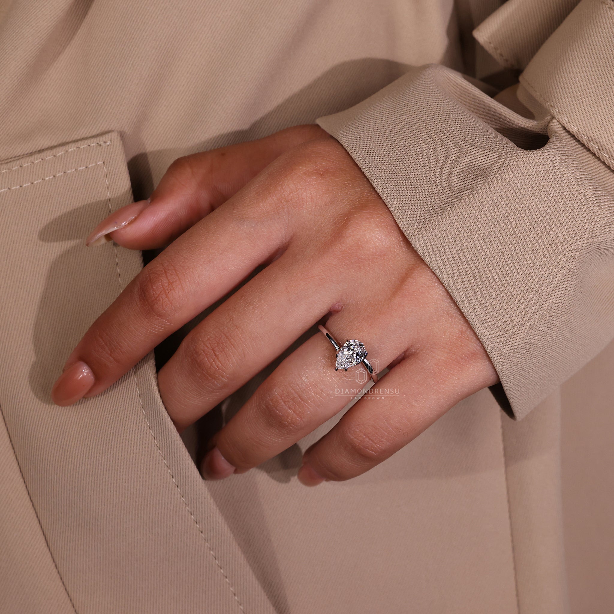 Diamond ring UK featuring pear cut and white gold finish.
