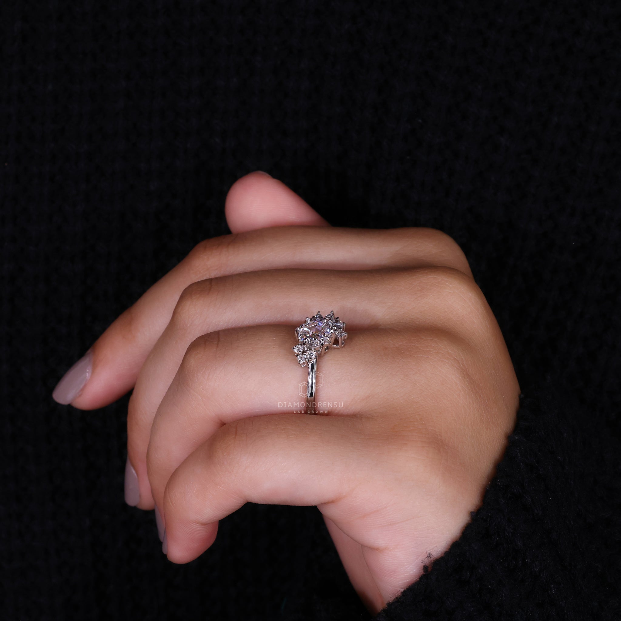 UK engagement ring featuring Marquise and Round side stone.
