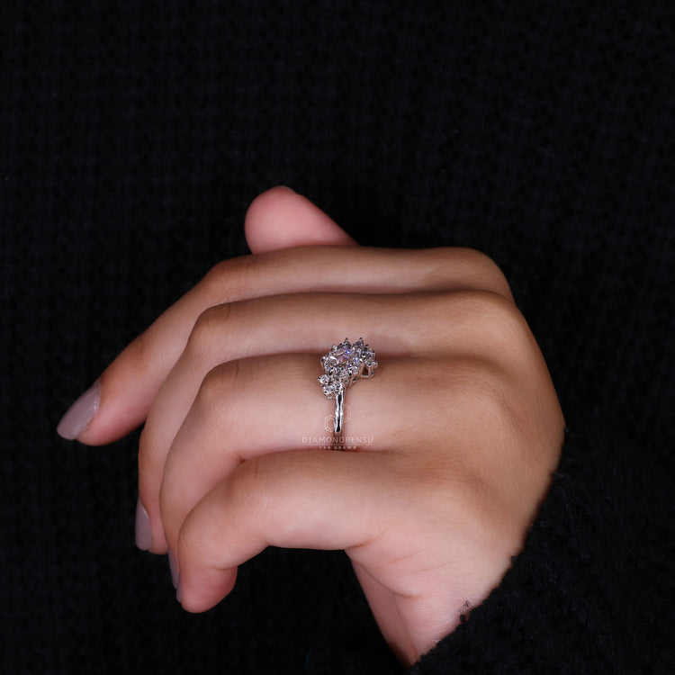 UK engagement ring featuring Marquise and Round side stone.
