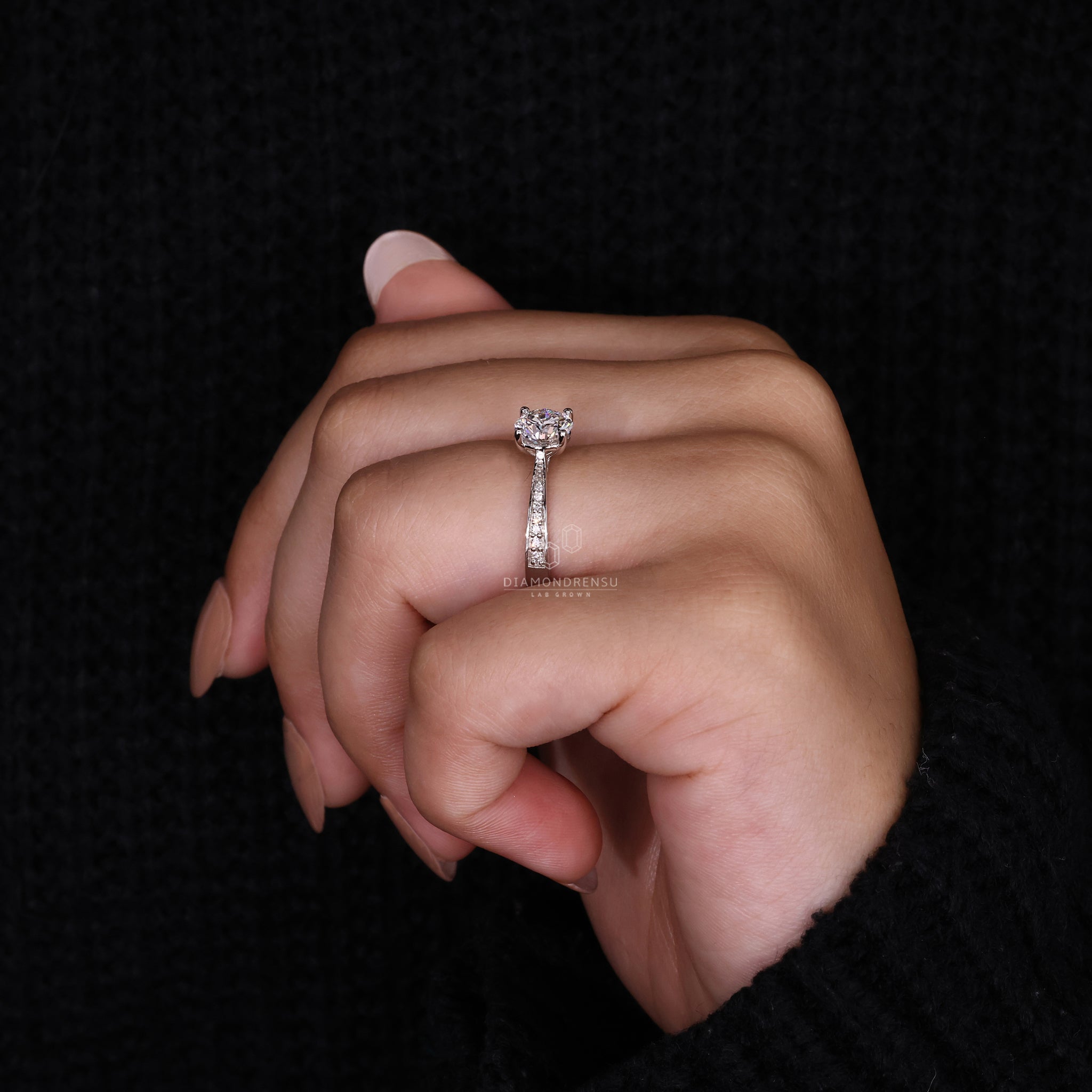 White gold ring designed with Tapered shank pave.
