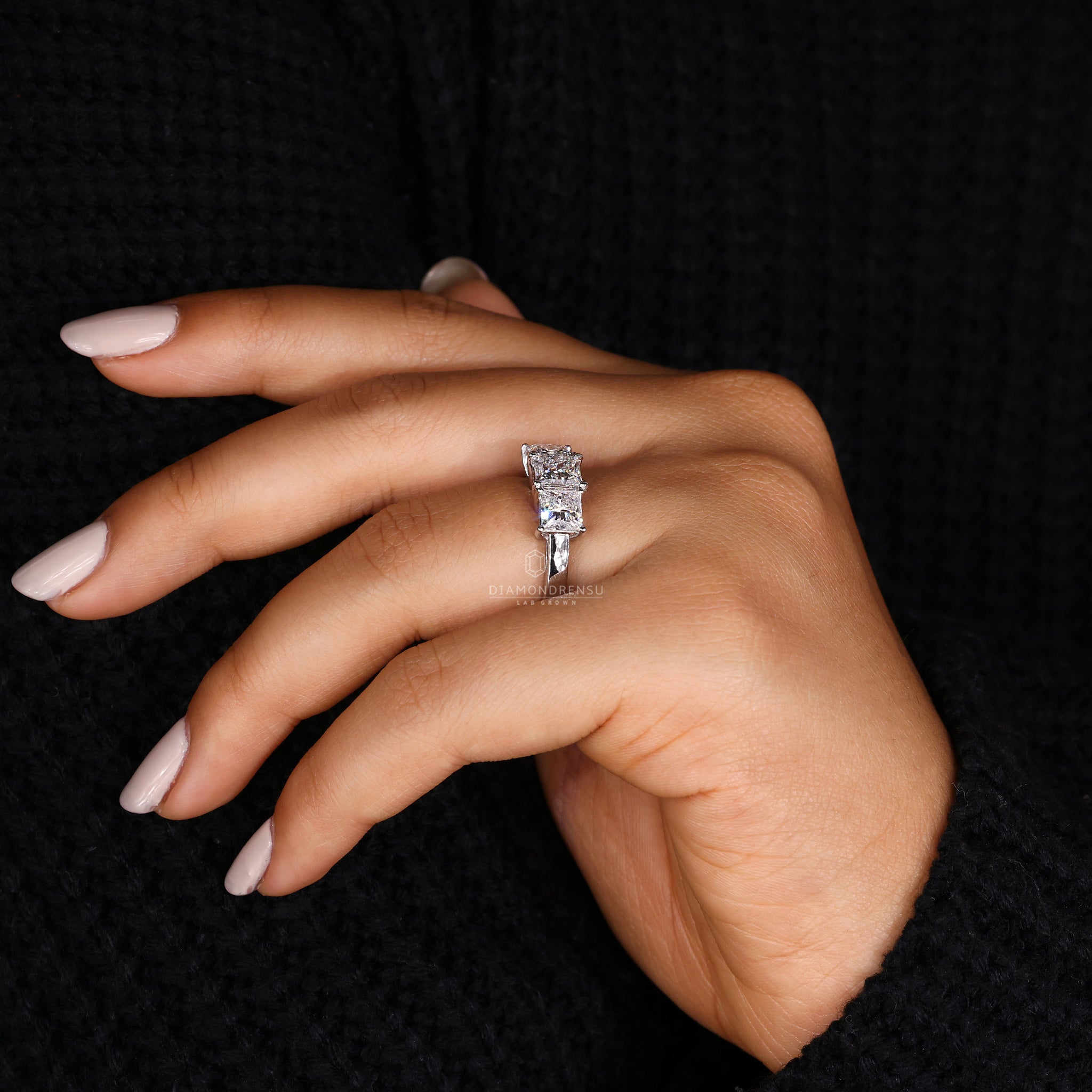 White gold diamond ring with elegant three stone layout
