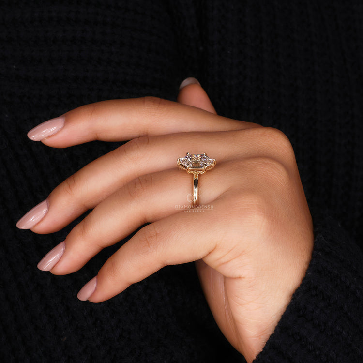 Yellow gold engagement ring with solitaire hexagon diamond design.
