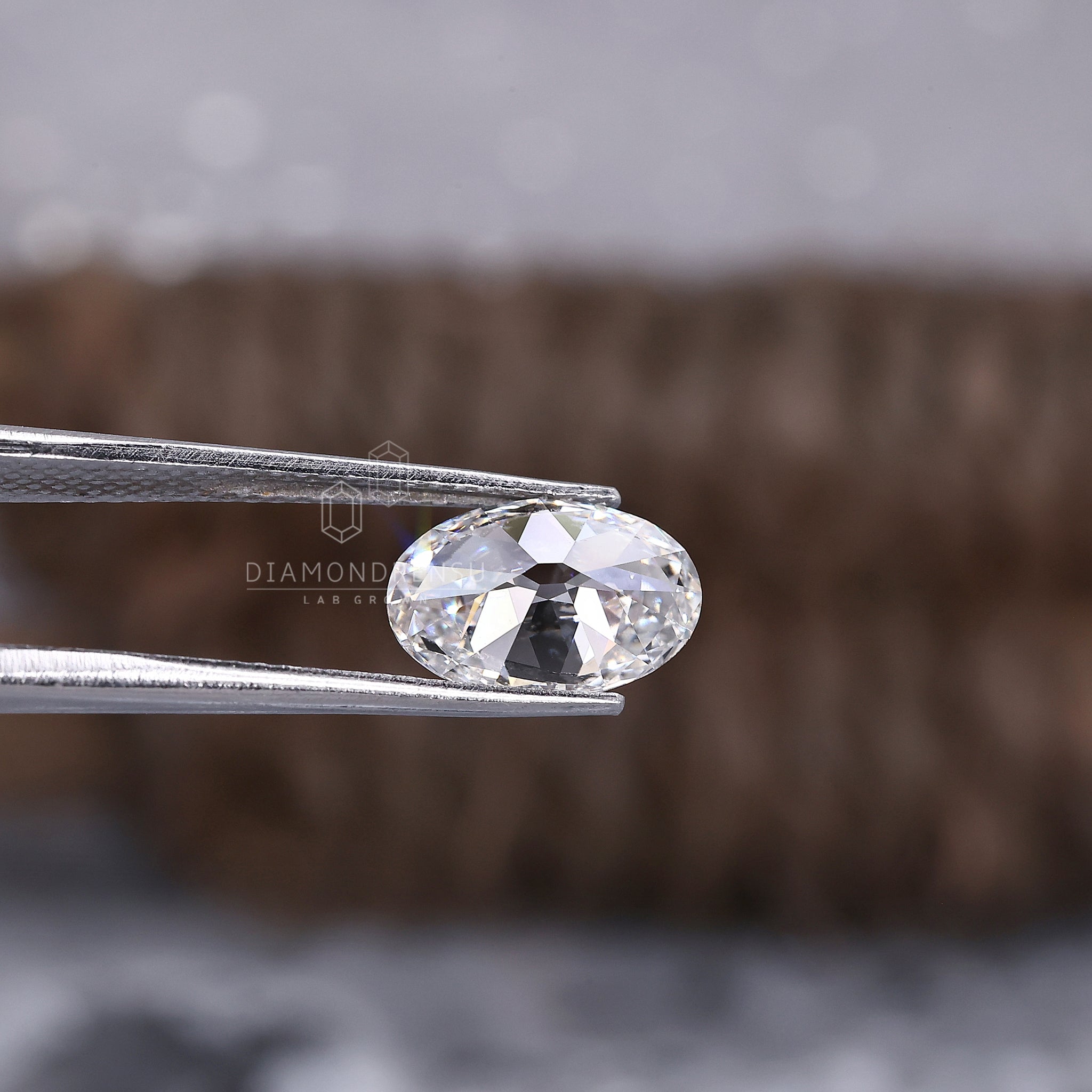 Oval lab grown diamond with brilliant fire and 2.07 carat weight.
