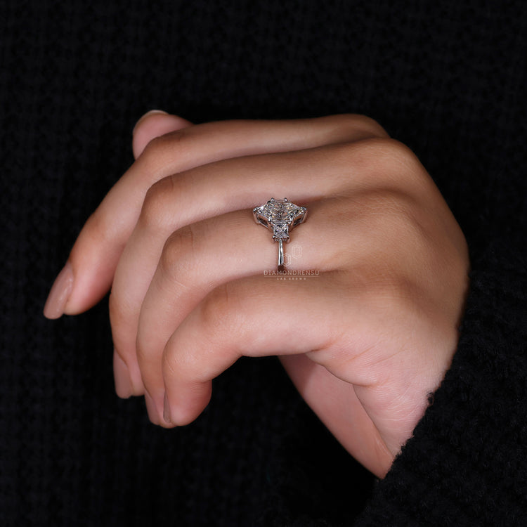 White gold ring styled as 3 stone engagement ring.
