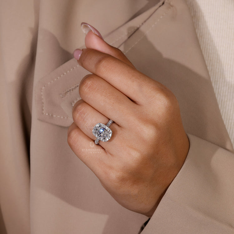 Lab diamond ring featuring halo setting with round diamonds and hidden accents.
