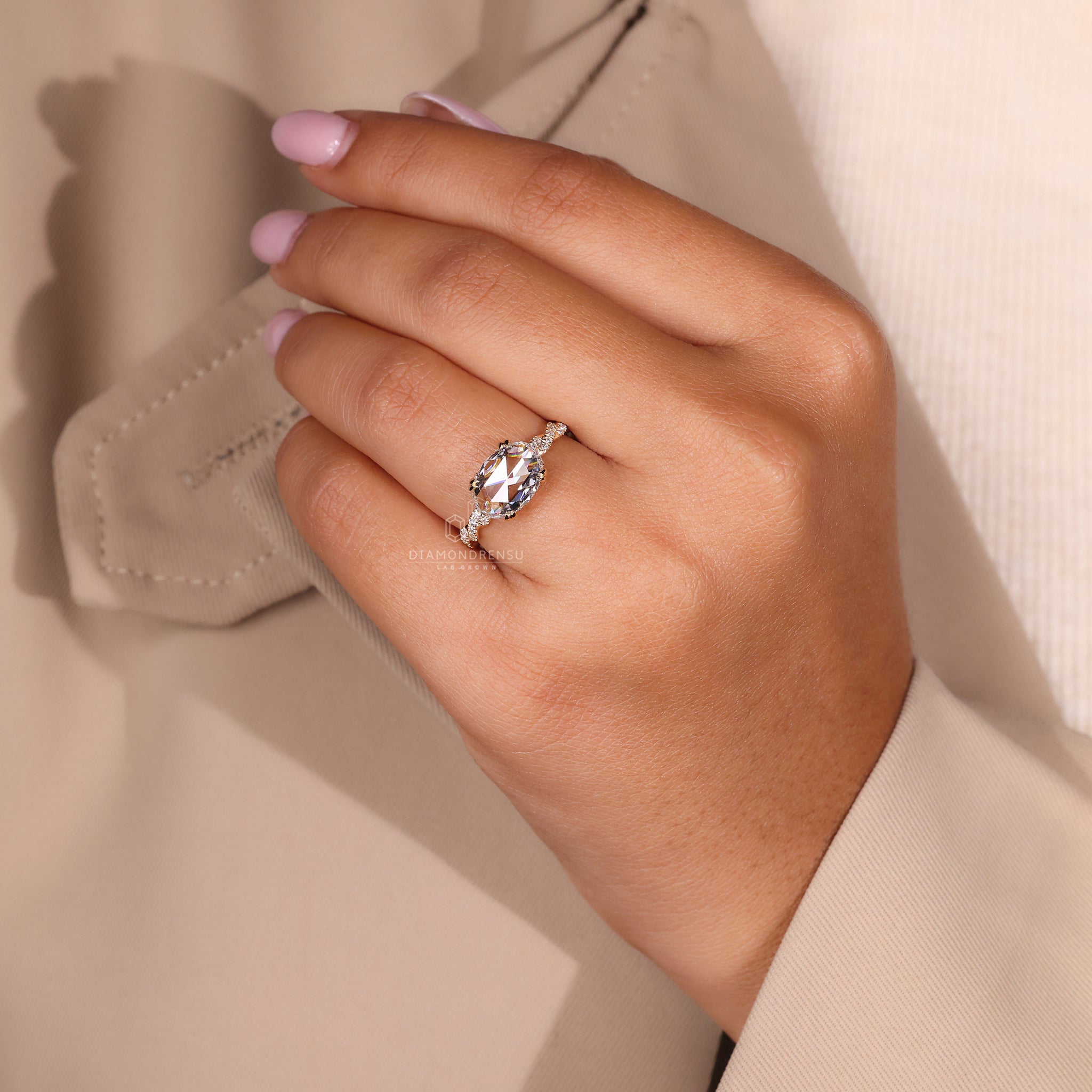 East west ring in round cut engagement ring style
