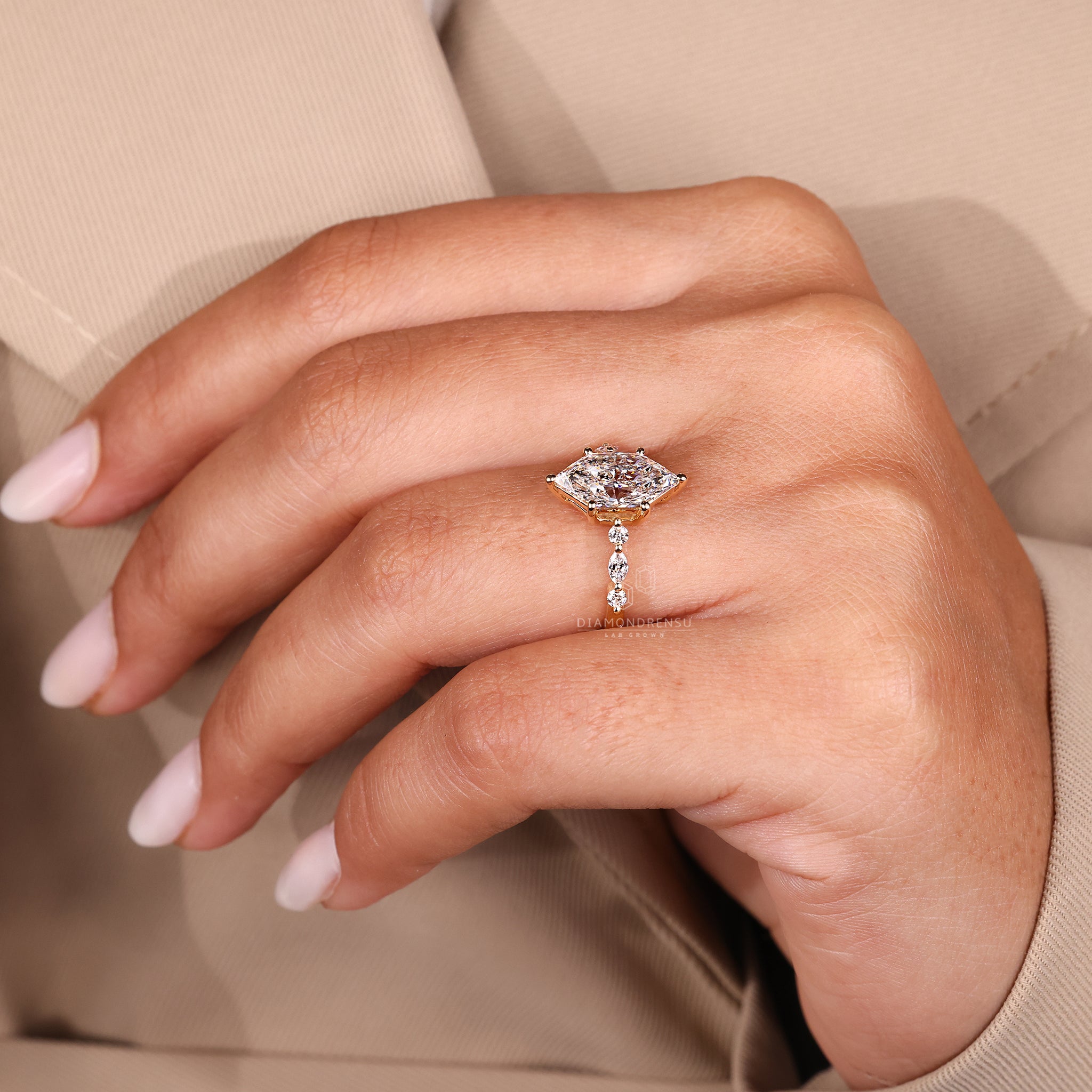 Buy diamond ring with marquise and round side stones.
