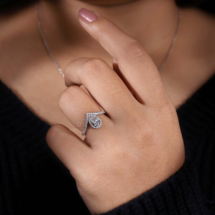 Halo ring setting showcasing a pear cut diamond, ideal for an elegant engagement ring for women.
